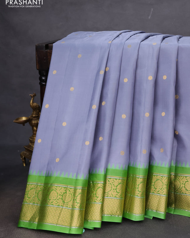 Pure gadwal silk saree grey and light green with zari woven buttas and temple design zari woven korvai border