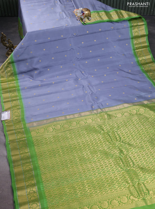Pure gadwal silk saree grey and light green with zari woven buttas and temple design zari woven korvai border