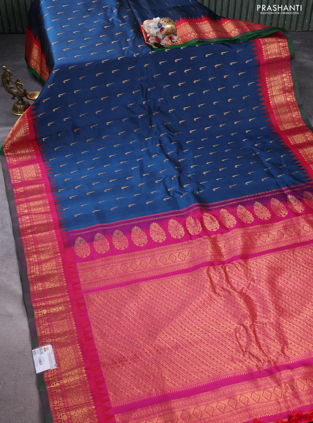 Pure gadwal silk saree peacock blue and pink with allover zari woven muniya buttas and temple design zari woven border
