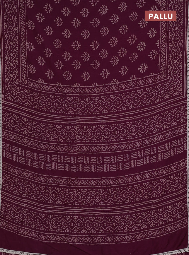 Semi pashmina silk saree wine shade and cream with allover butta prints and crocia lace work border