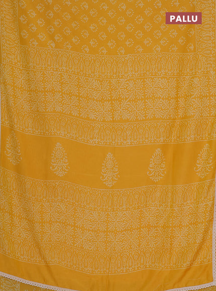 Semi pashmina silk saree yellow and cream with allover butta prints and crocia lace work border