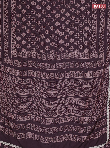 Semi pashmina silk saree wine shade and cream with allover butta prints and crocia lace work border
