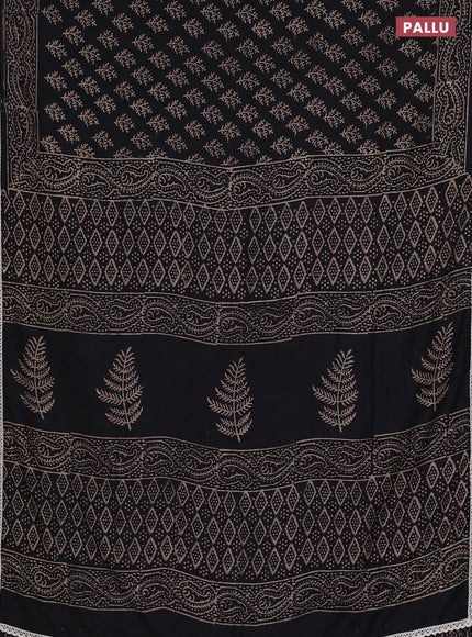 Semi pashmina silk saree black and cream with allover butta prints and crocia lace work border