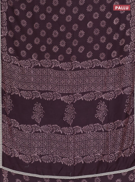 Semi pashmina silk saree wine shade and cream with allover butta prints and crocia lace work border