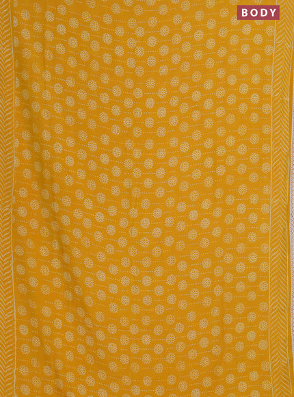 Semi pashmina silk saree yellow and cream with allover prints and crocia lace work border