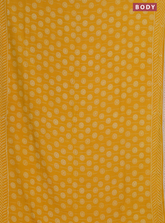 Semi pashmina silk saree yellow and cream with allover prints and crocia lace work border