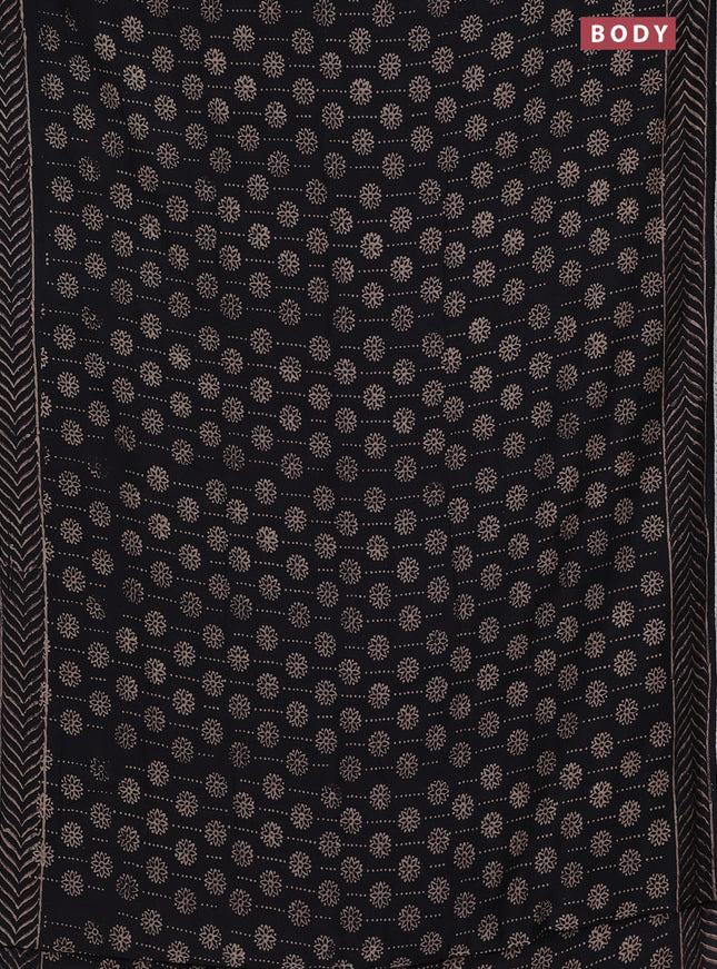 Semi pashmina silk saree black and cream with allover prints and crocia lace work border