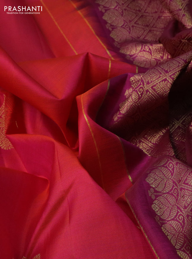 Pure kanchipuram silk saree dual shade of pinkish orange and purple with zari woven buttas and zari woven border