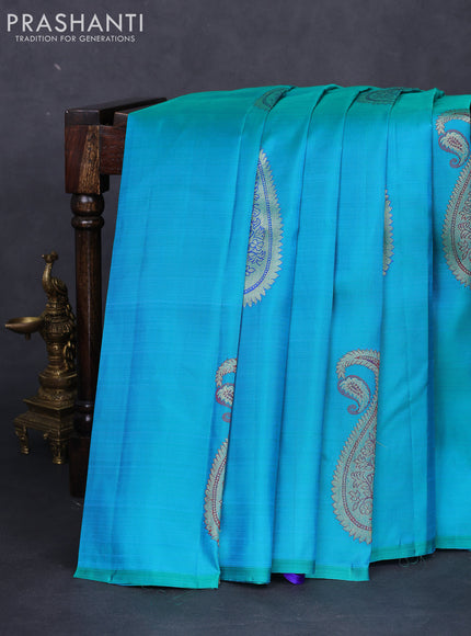 Pure kanchipuram silk saree dual shade of teal blue and royal blue with paisley zari woven buttas in borderless style