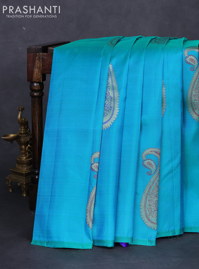 Pure kanchipuram silk saree dual shade of teal blue and royal blue with paisley zari woven buttas in borderless style
