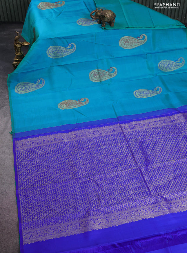 Pure kanchipuram silk saree dual shade of teal blue and royal blue with paisley zari woven buttas in borderless style