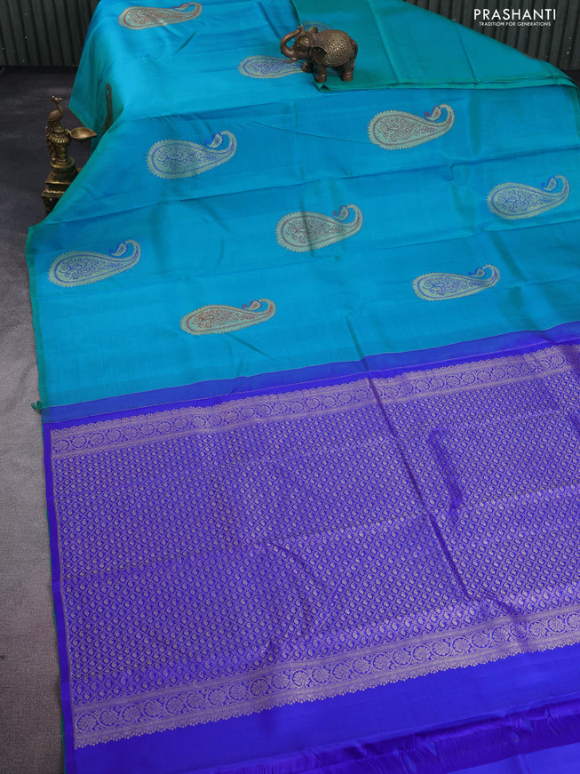 Pure kanchipuram silk saree dual shade of teal blue and royal blue with paisley zari woven buttas in borderless style