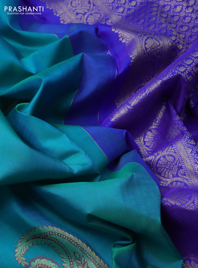 Pure kanchipuram silk saree dual shade of teal blue and royal blue with paisley zari woven buttas in borderless style