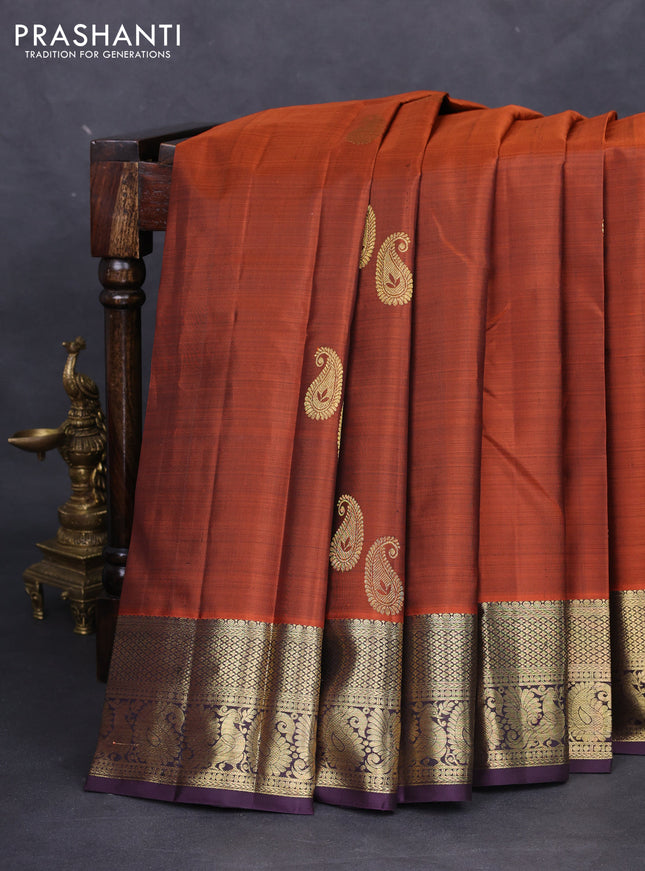 Pure kanchipuram silk saree rustic orange and deep jamun with paisley zari woven buttas and annam zari woven border