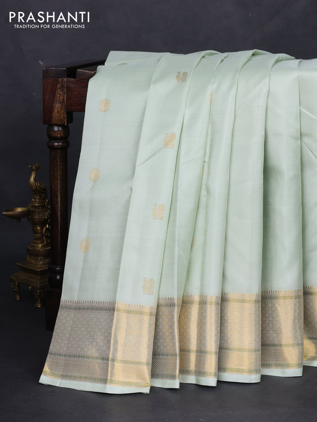 Pure kanchipuram silk saree pista green with annam zari woven buttas and zari woven border