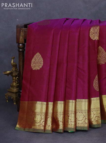 Pure kanchipuram silk saree dual shade of maroonish blue and dual shade of green with zari woven buttas and floral design zari woven border