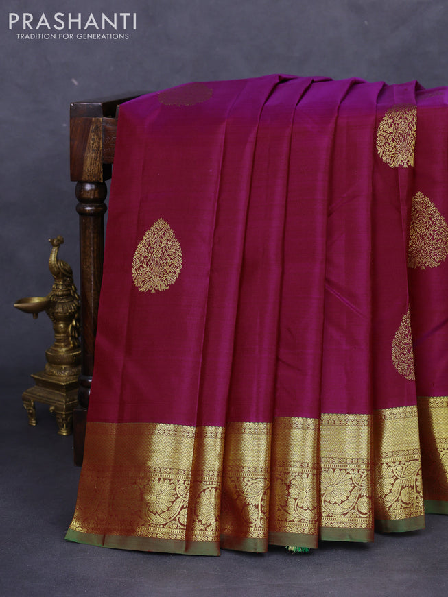 Pure kanchipuram silk saree dual shade of maroonish blue and dual shade of green with zari woven buttas and floral design zari woven border