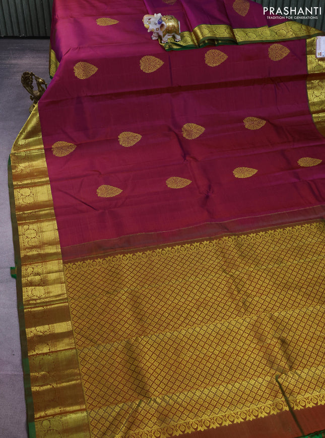 Pure kanchipuram silk saree dual shade of maroonish blue and dual shade of green with zari woven buttas and floral design zari woven border