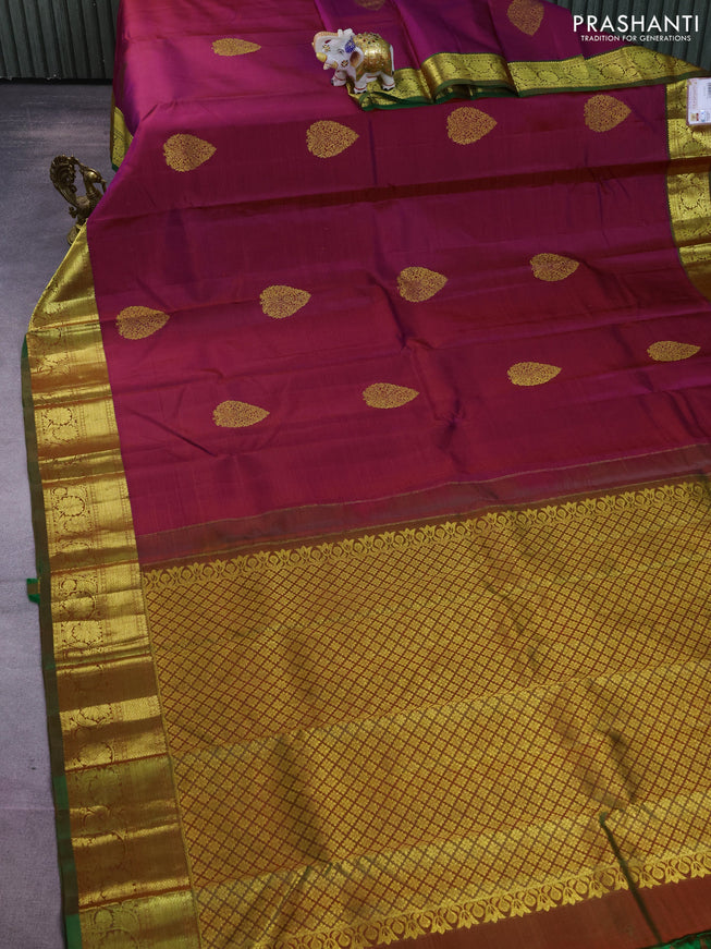 Pure kanchipuram silk saree dual shade of maroonish blue and dual shade of green with zari woven buttas and floral design zari woven border