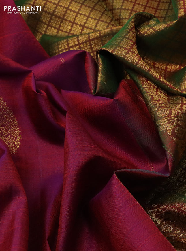 Pure kanchipuram silk saree dual shade of maroonish blue and dual shade of green with zari woven buttas and floral design zari woven border