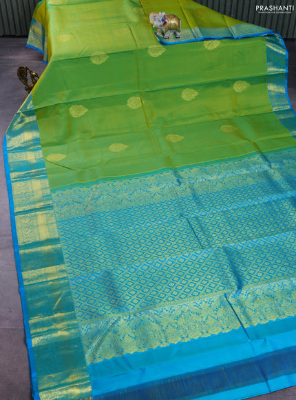 Pure kanchipuram silk saree light green and teal blue with zari woven buttas and zari woven border