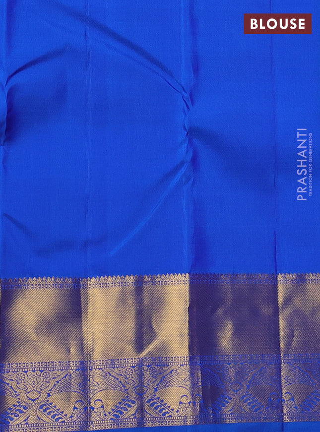 Pure kanchipuram silk saree dual shade of maroon and cs blue with zari woven floral buttas and zari woven border