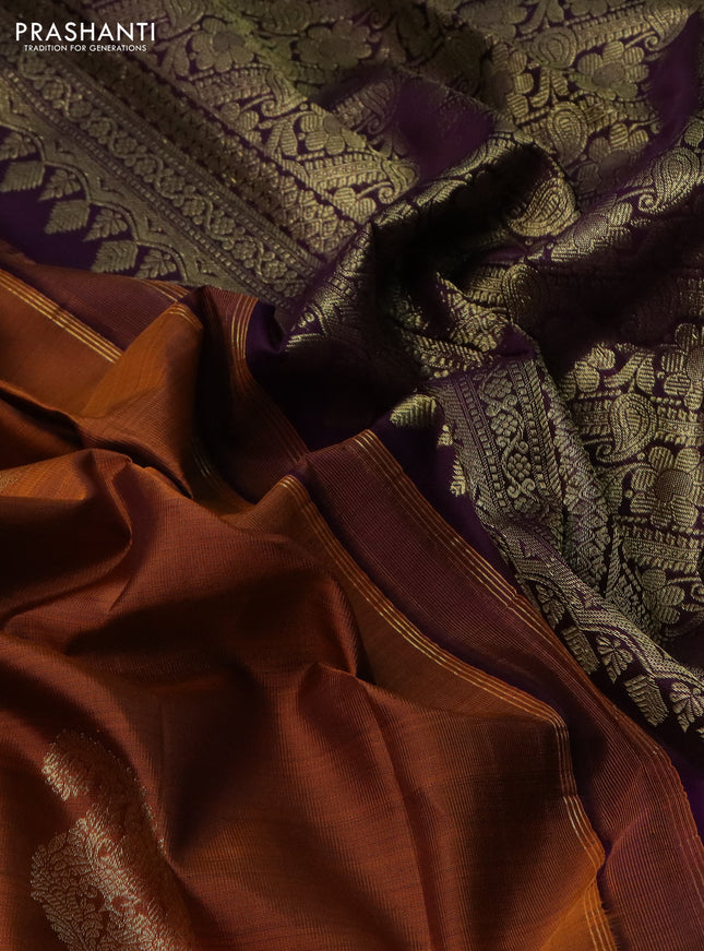 Pure kanchipuram silk saree mustard shade and deep violet with paisley zari woven buttas and long zari woven border
