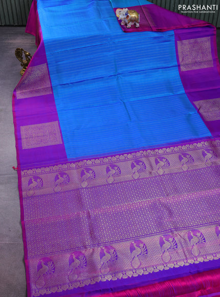 Pure kanchipuram silk saree cs blue and purple with allover zari weaves and zari woven box type butta border