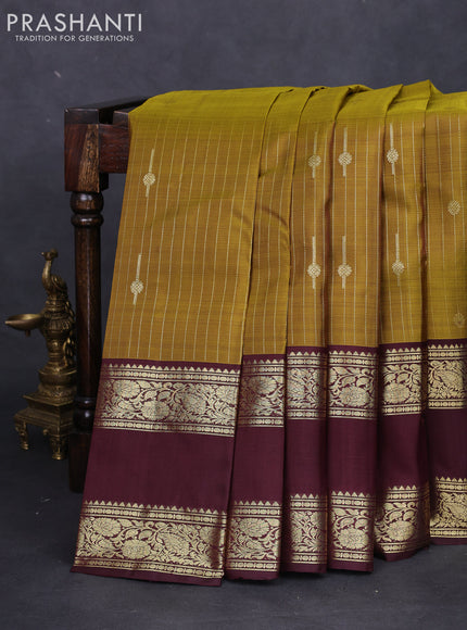 Pure kanchipuram silk saree mehendi green and deep maroon with allover zari weaves & buttas and rettapet zari woven border