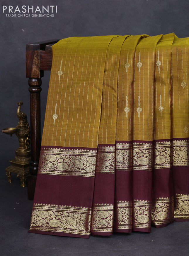 Pure kanchipuram silk saree mehendi green and deep maroon with allover zari weaves & buttas and rettapet zari woven border