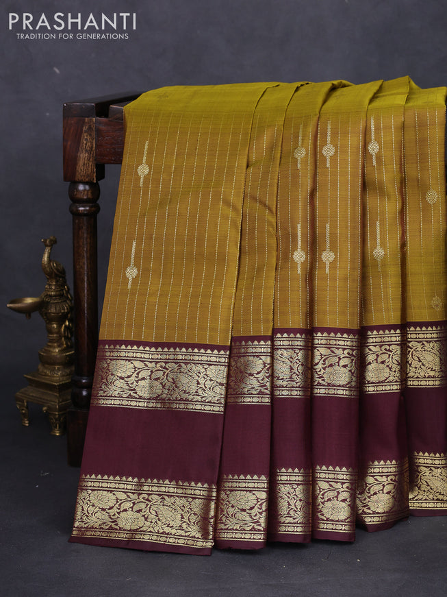Pure kanchipuram silk saree mehendi green and deep maroon with allover zari weaves & buttas and rettapet zari woven border