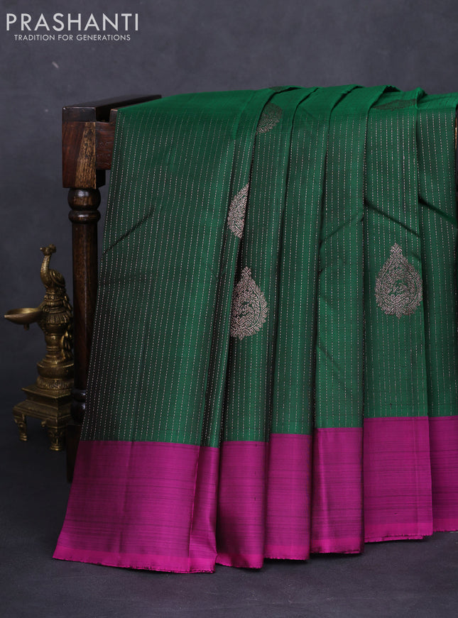 Pure kanchipuram silk saree green and magenta pink with allover zari weaves and simple border