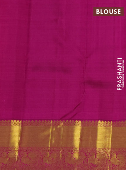 Pure kanchipuram silk saree dual shade of pinkish orange and purple with zari woven buttas and annam zari woven border