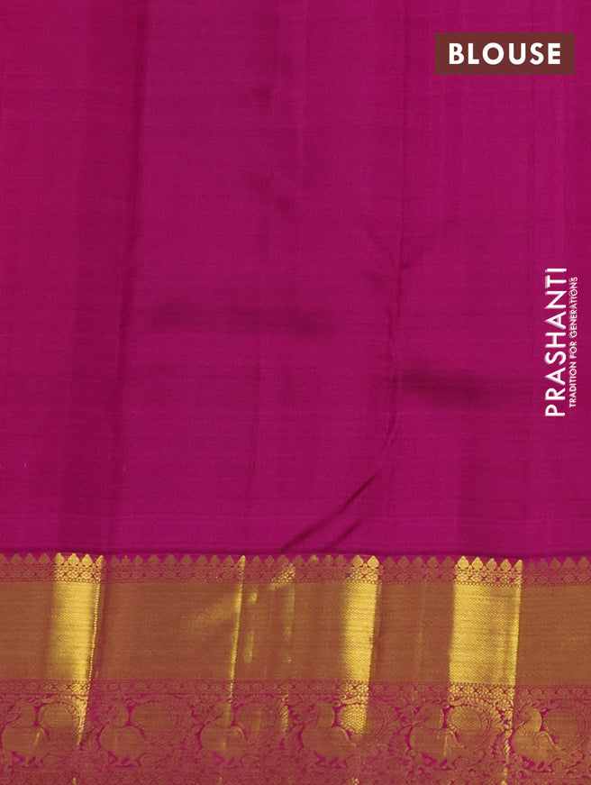 Pure kanchipuram silk saree dual shade of pinkish orange and purple with zari woven buttas and annam zari woven border