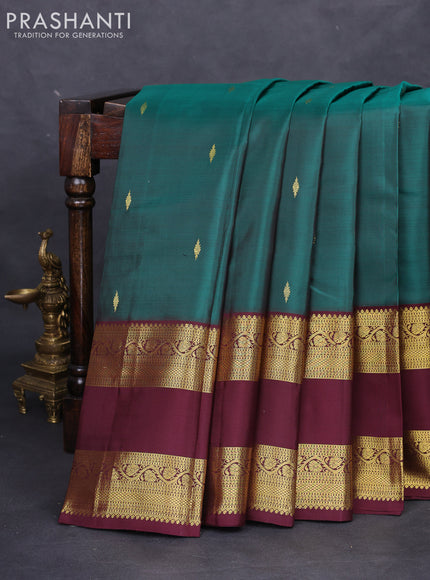 Pure kanchipuram silk saree peacock green and deep maroon with zari woven buttas and rettapet zari woven border