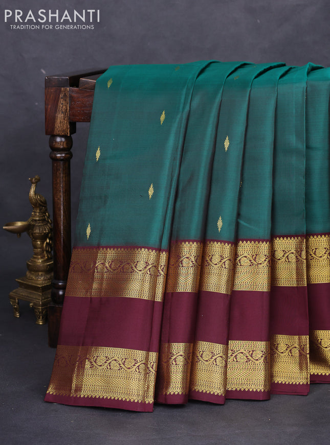 Pure kanchipuram silk saree peacock green and deep maroon with zari woven buttas and rettapet zari woven border