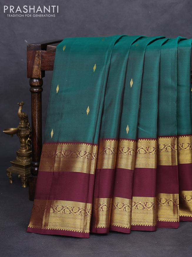 Pure kanchipuram silk saree peacock green and deep maroon with zari woven buttas and rettapet zari woven border