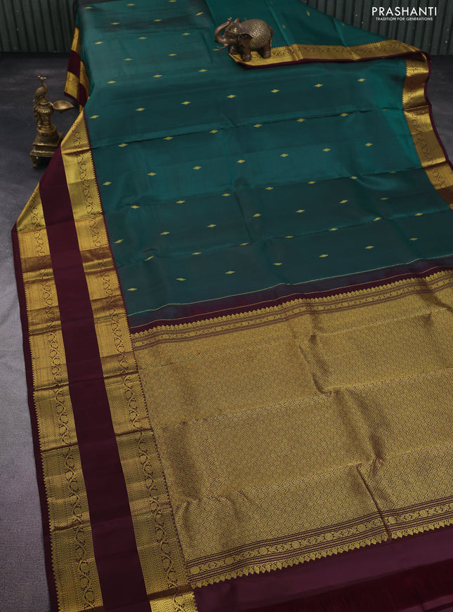 Pure kanchipuram silk saree peacock green and deep maroon with zari woven buttas and rettapet zari woven border