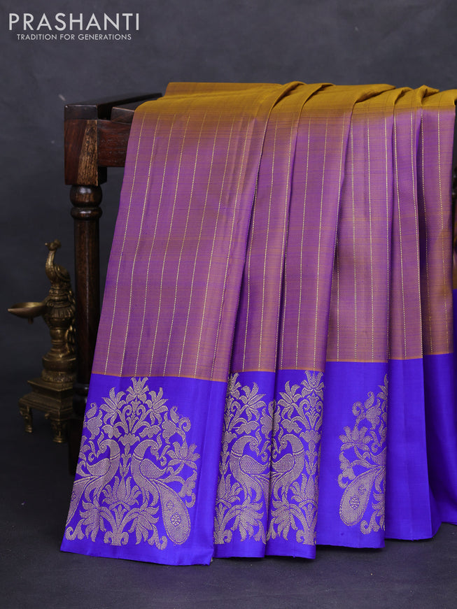 Pure kanchipuram silk saree dual shade of green and royal blue with allover zari weaves and zari woven butta border