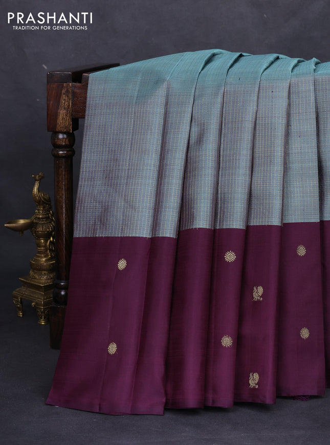 Pure kanchipuram silk saree teal shade and deep jamun with allover small zari checks and zari woven butta border