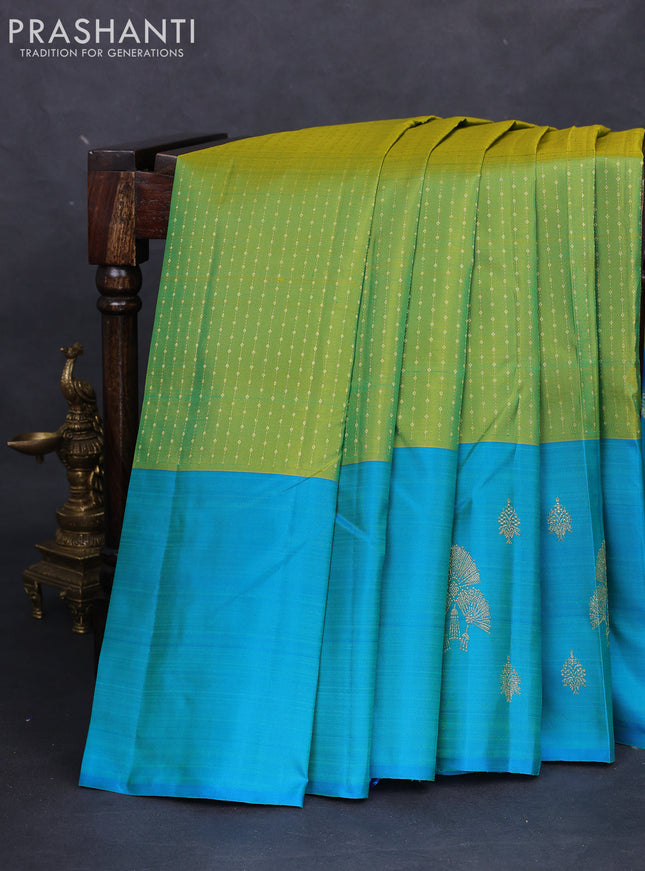 Pure kanchipuram silk saree light green and teal blue with allover zari weaves and zari woven butta border