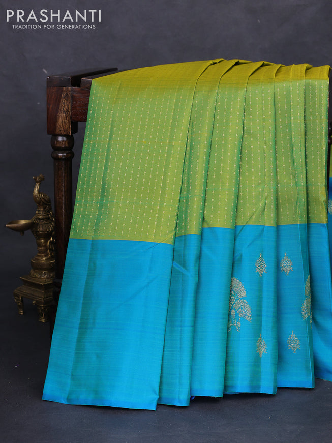 Pure kanchipuram silk saree light green and teal blue with allover zari weaves and zari woven butta border