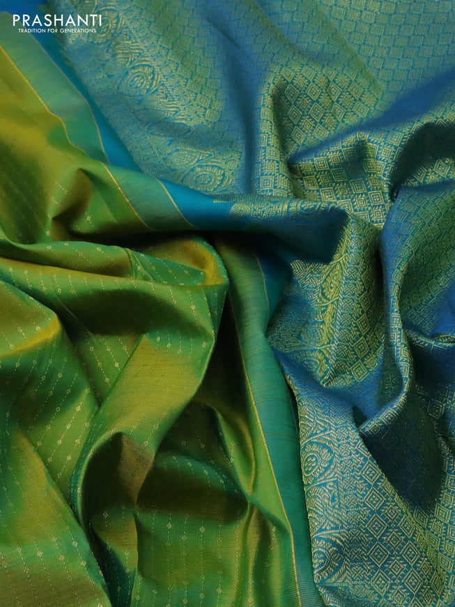 Pure kanchipuram silk saree light green and teal blue with allover zari weaves and zari woven butta border