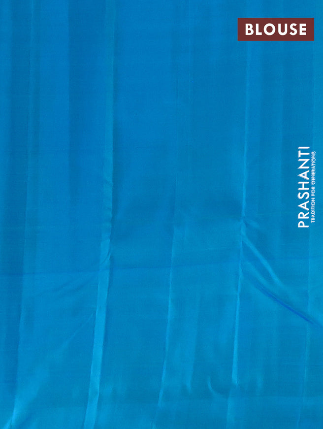 Pure kanchipuram silk saree light green and teal blue with allover zari weaves and zari woven butta border