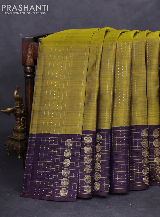 Pure kanchipuram silk saree mehendi green and deep jamun with allover zari weaves and rich zari border
