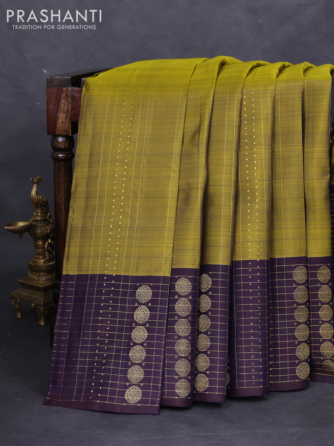 Pure kanchipuram silk saree mehendi green and deep jamun with allover zari weaves and rich zari border