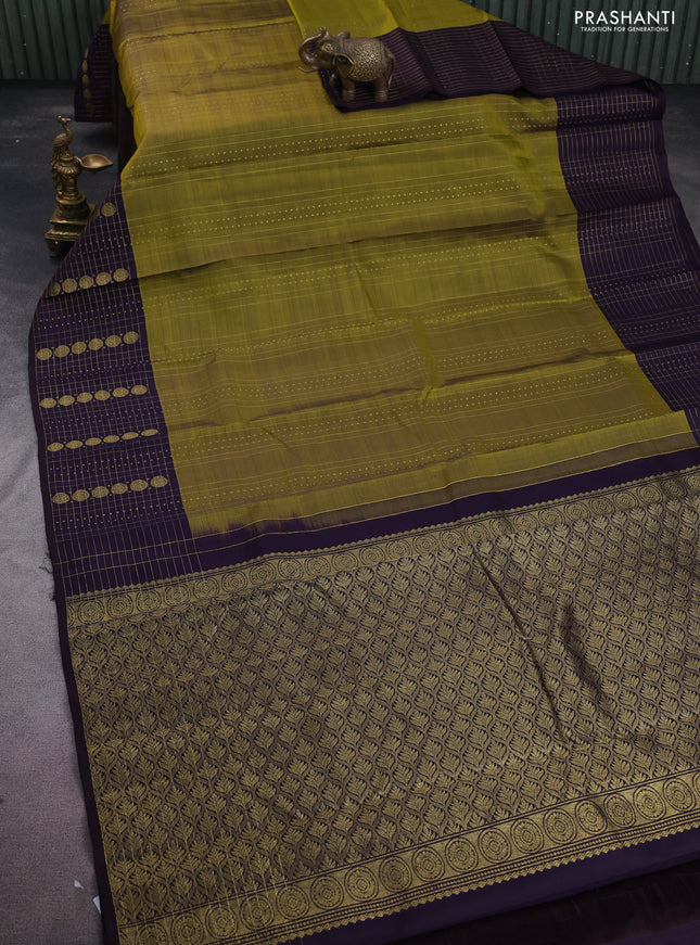 Pure kanchipuram silk saree mehendi green and deep jamun with allover zari weaves and rich zari border