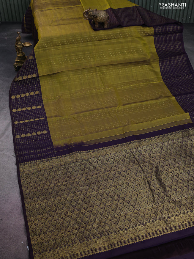 Pure kanchipuram silk saree mehendi green and deep jamun with allover zari weaves and rich zari border