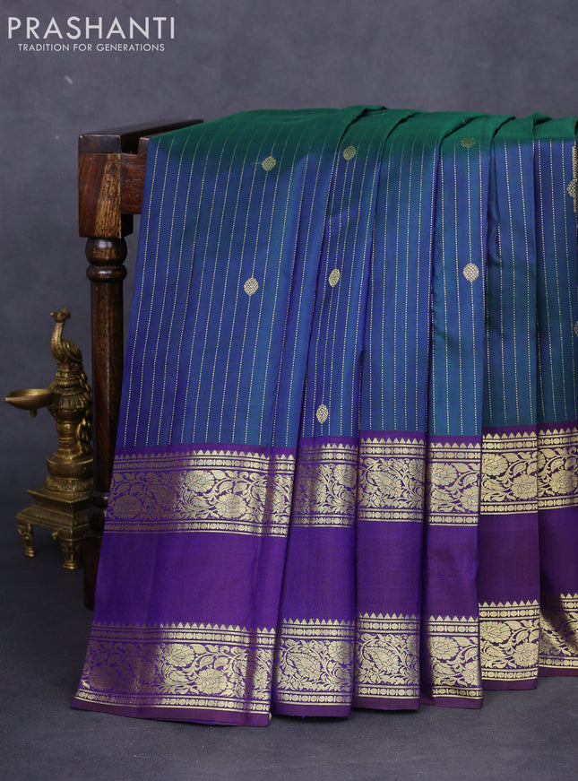 Pure kanchipuram silk saree dual shade of green and deep jamun with allover zari stripes pattern and zari woven border