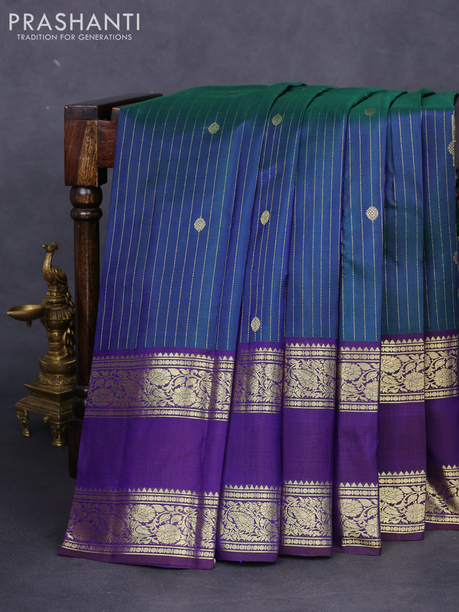Pure kanchipuram silk saree dual shade of green and deep jamun with allover zari stripes pattern and zari woven border